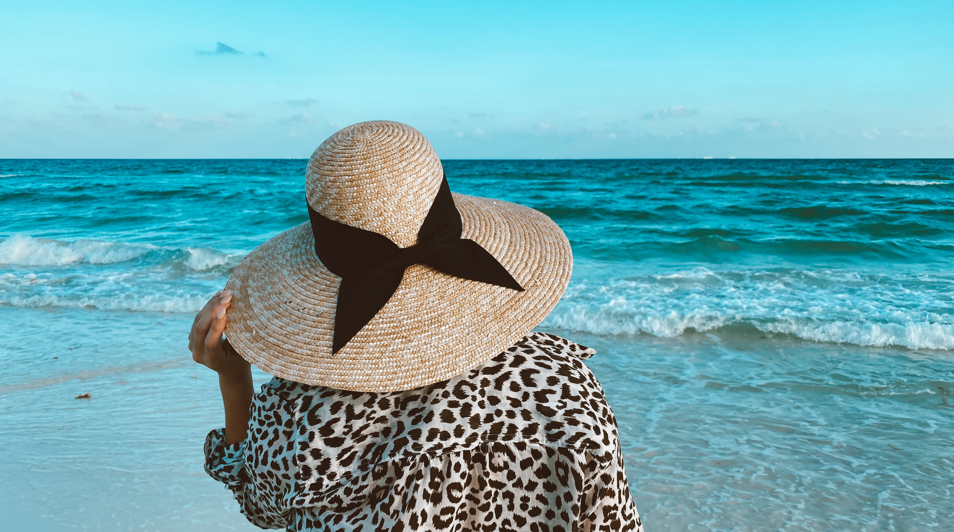 Fashion and travel blogger KatWalkSF in an ASOS hat in Playa del Carmen.