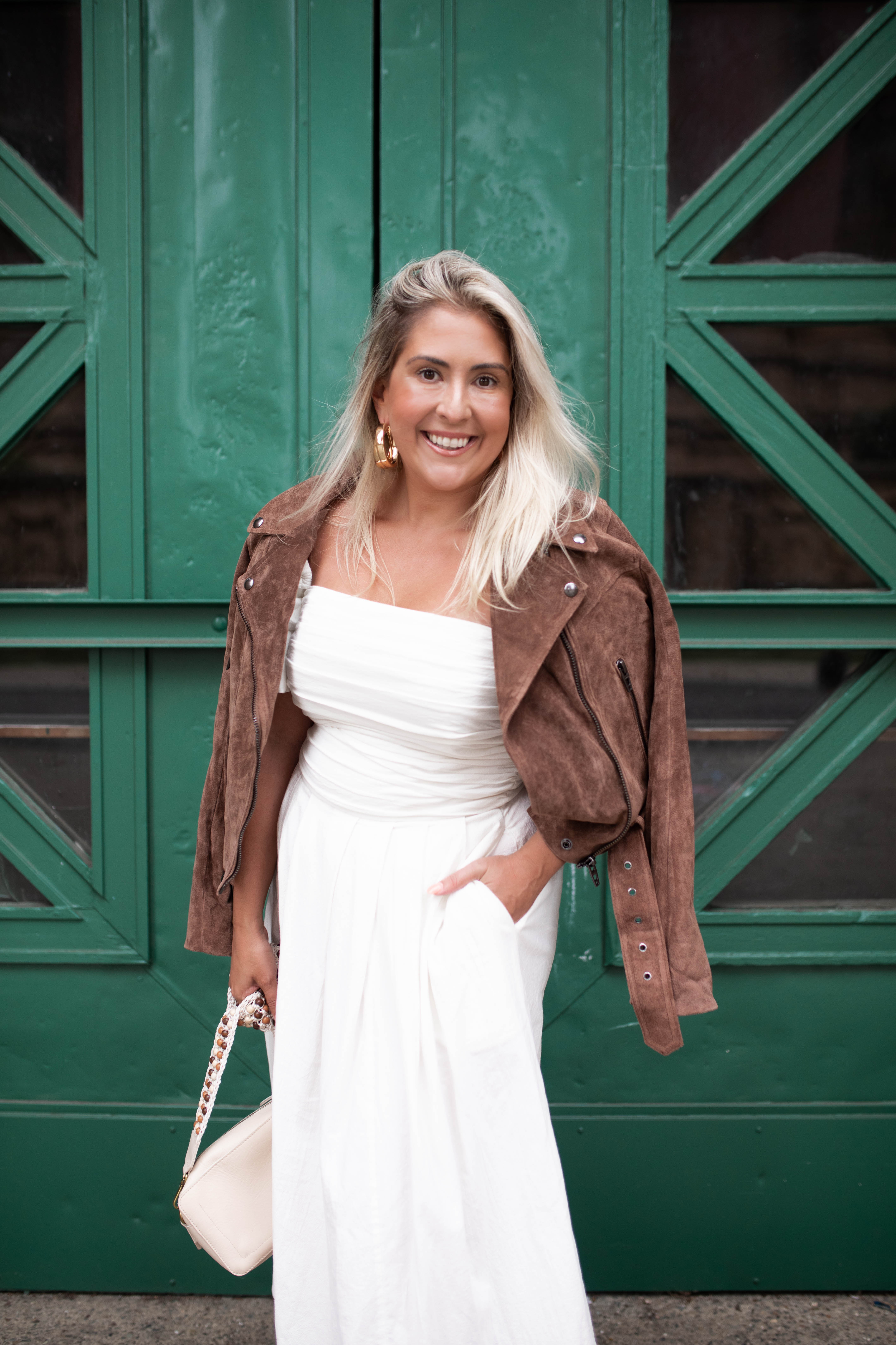 San Francisco blogger Katwalksf styles the Free People Ain't She a Beaut Puff Sleeve Ruched Dress with a brown suede jacket.
