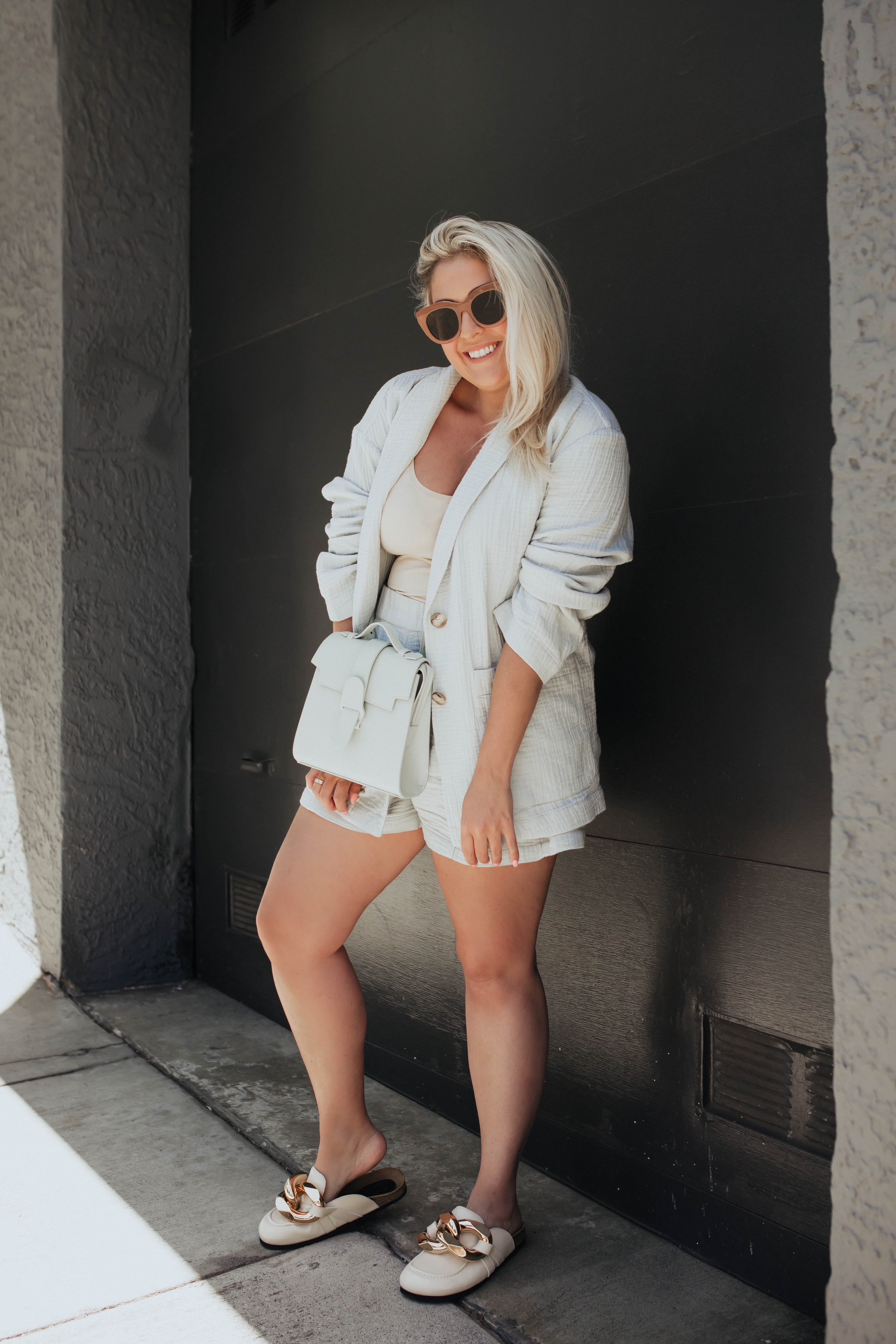 San Francisco blogger KatWalkSF in a Madewell shorts suit and the Senrve Alunna Bag