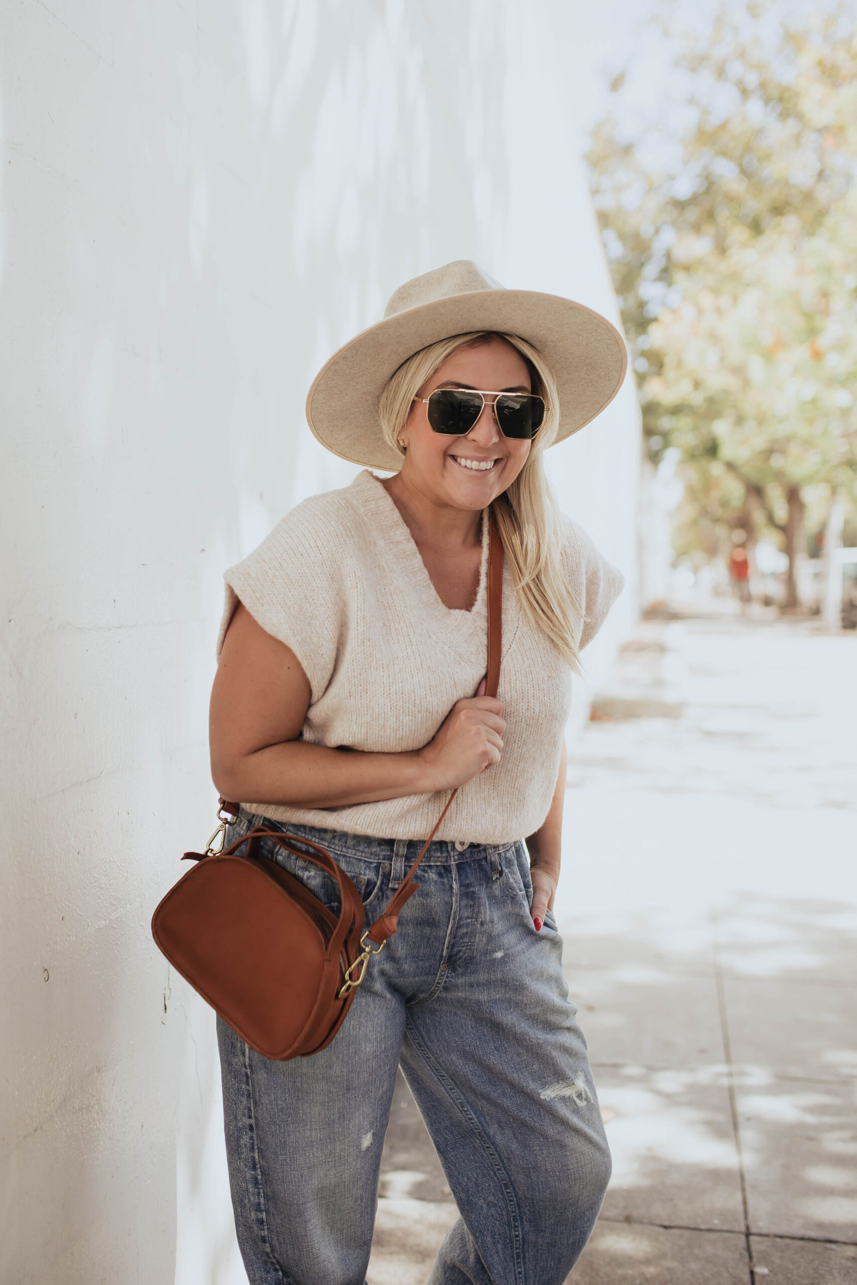 The Fall Madewell Edit, San Francisco blogger KatWalkSF wears the Madewell cropped sweater vest and The Sydney Zip-Top Crossbody Bag