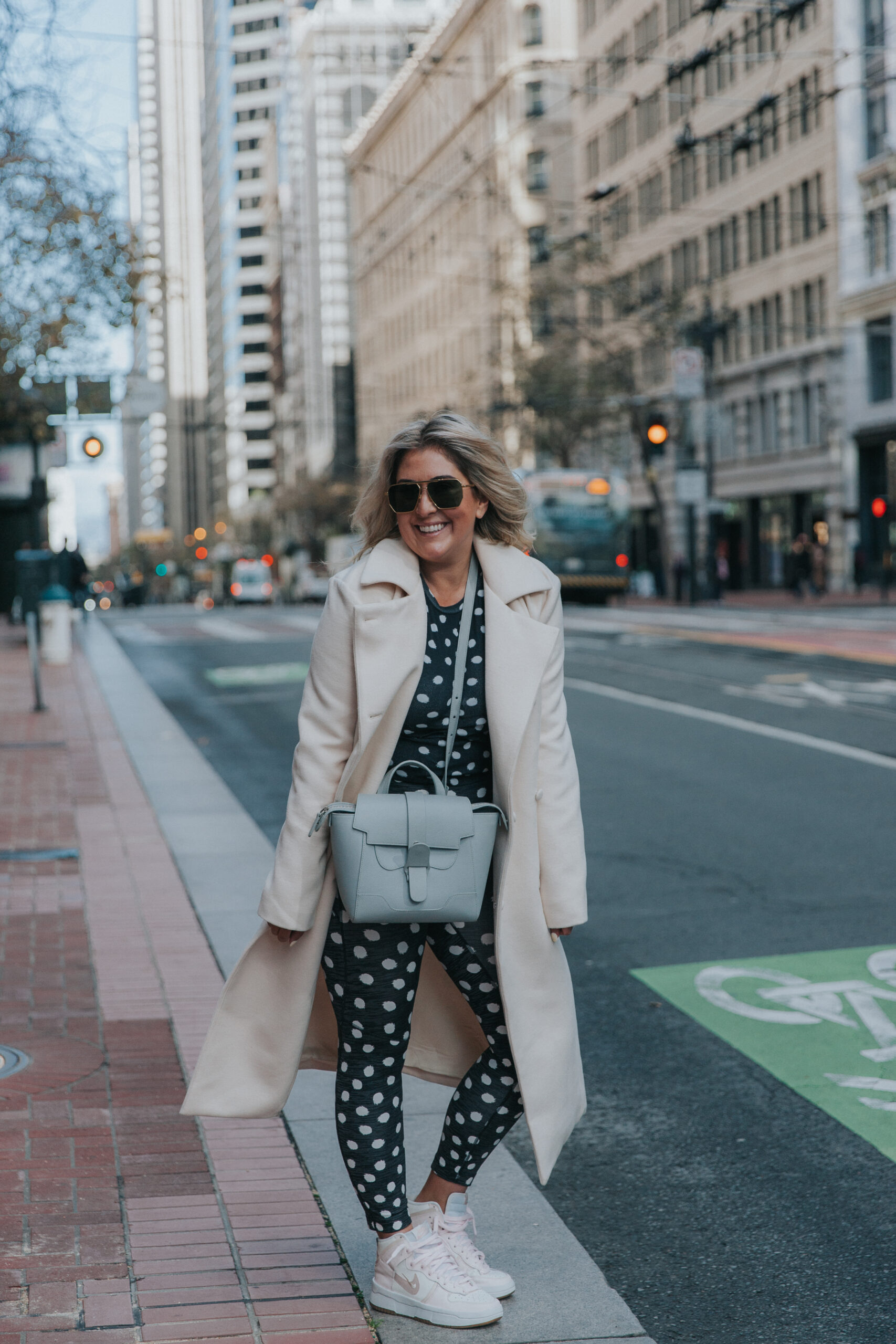 San Francisco fashion and lifestyle blogger KatWalkSF wearing the Outdoor Voices polka dot set and Nike Dunk High Rebel leather sneakers