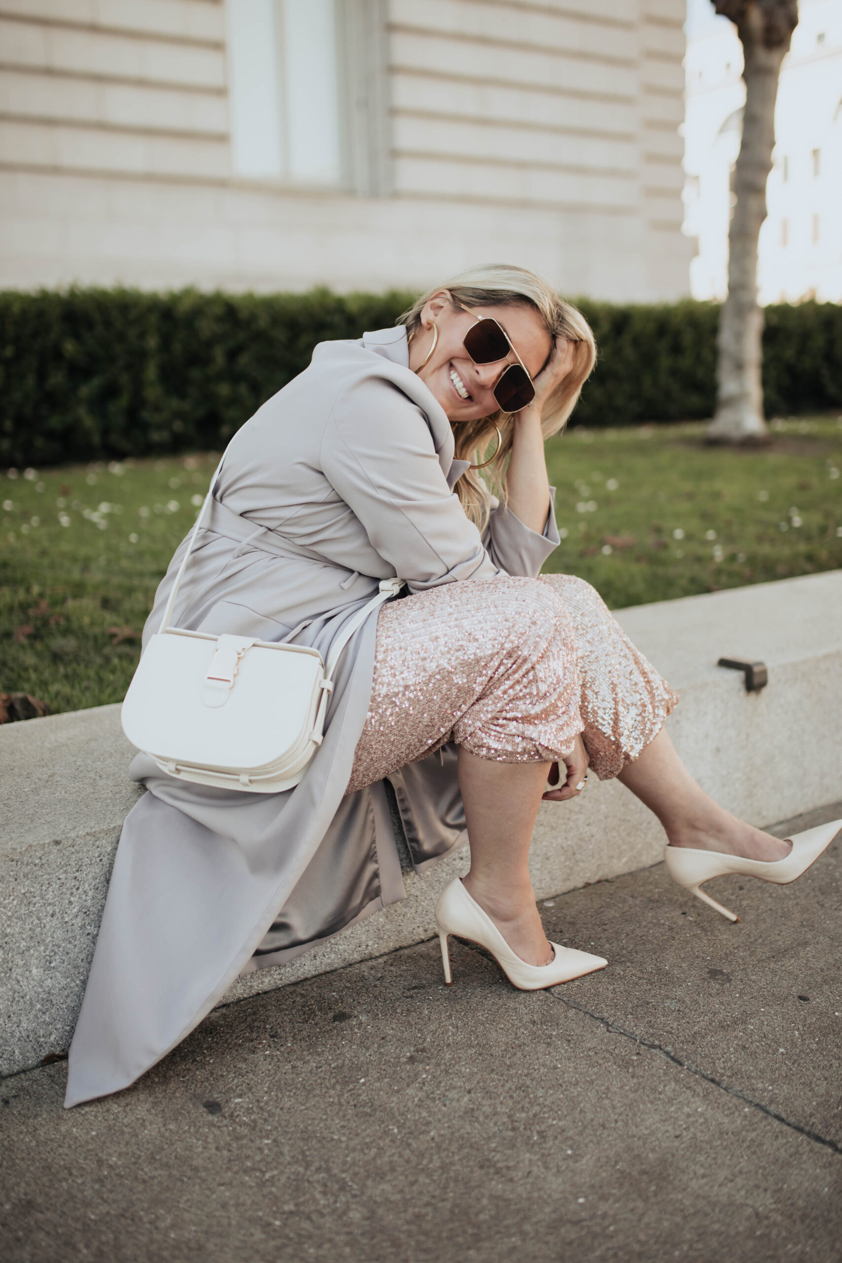San Francisco fashion and lifestyle blogger KatWalkSF styles the new Senreve Cadence Crossbody Bag in front of City Hall.